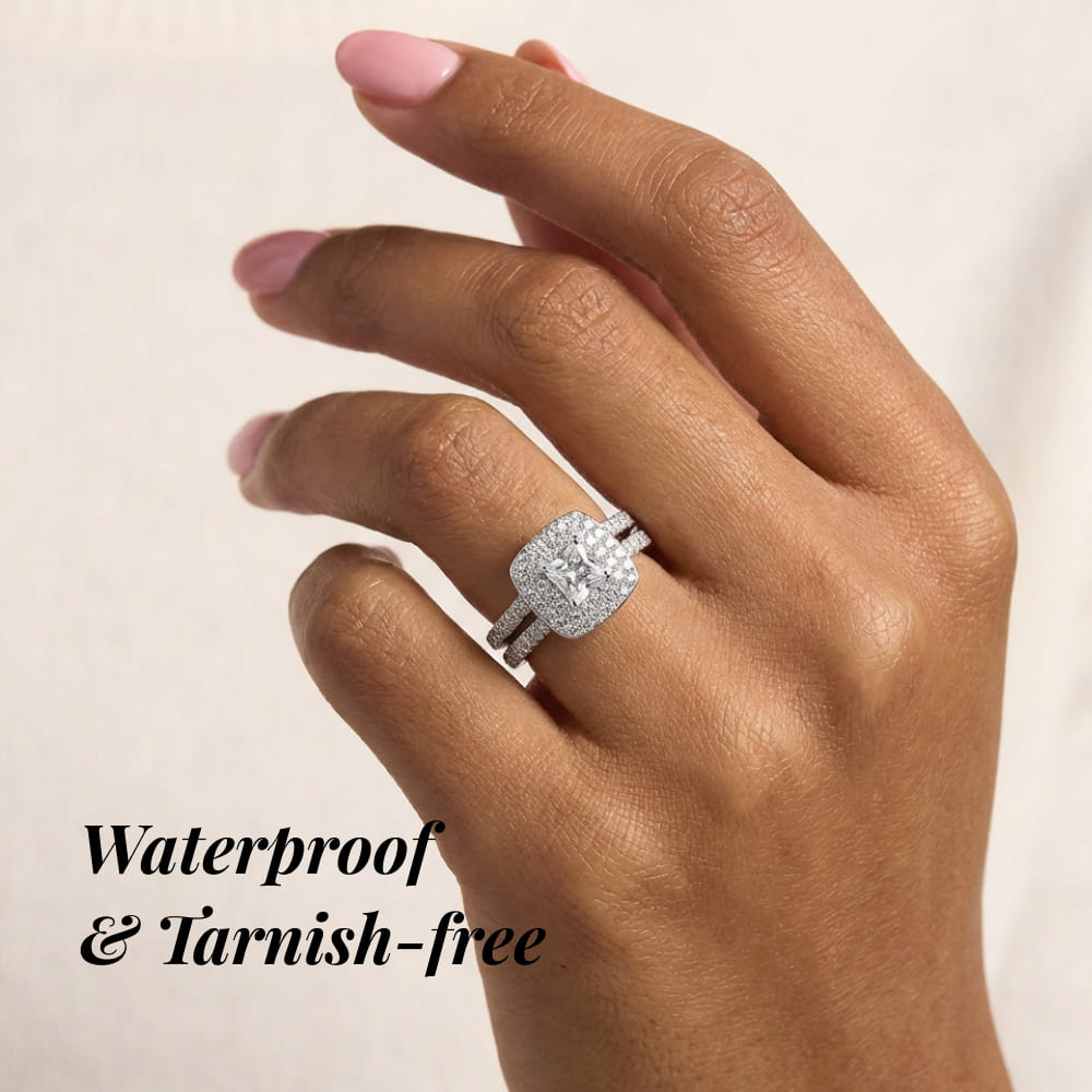 Hand wearing a diamond ring with text 'Waterproof & Tarnish-free' on a beige background