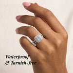 Hand wearing a diamond ring with text 'Waterproof & Tarnish-free' on a beige background