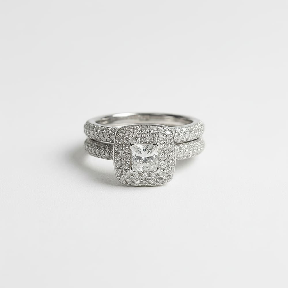 Stack of diamond rings on a light gray background