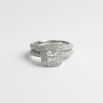 Stack of diamond rings on a light gray background