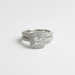 Stack of diamond rings on a light gray background