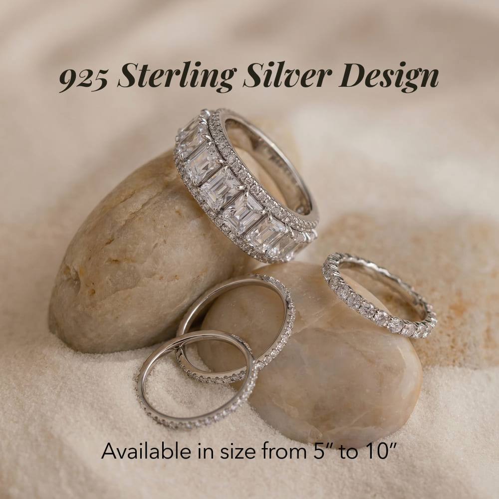 Silver rings with gemstones on a stone surface, labeled '925 Sterling Silver Design'.