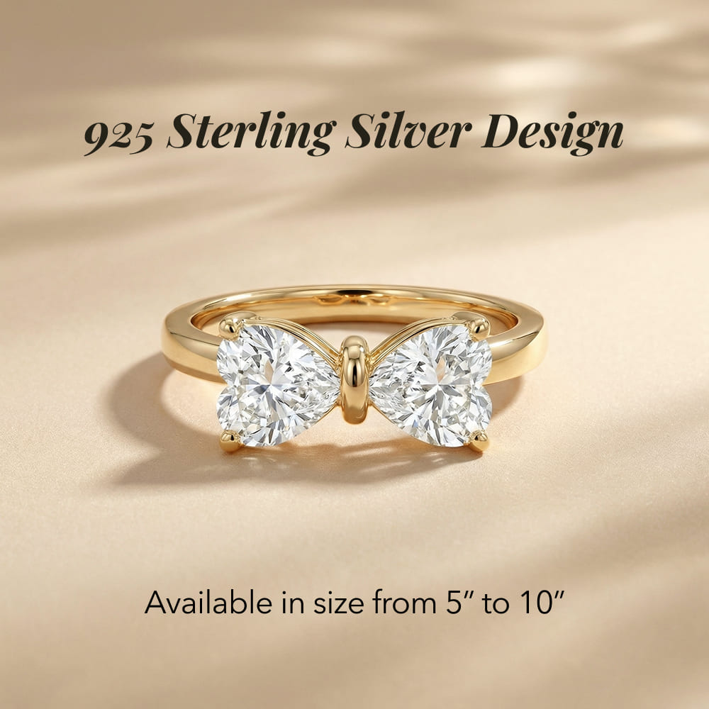 Gold ring with butterfly design on a beige background, labeled '925 Sterling Silver Design'.