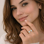 Woman wearing a diamond ring with a soft background