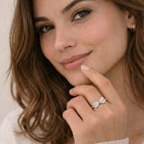 Woman wearing a diamond ring with a soft background